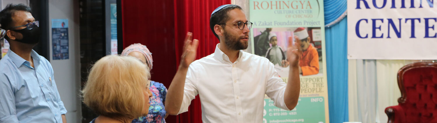 Rabbi Ari Hart convenes with members of the Rohingya Community Center.
