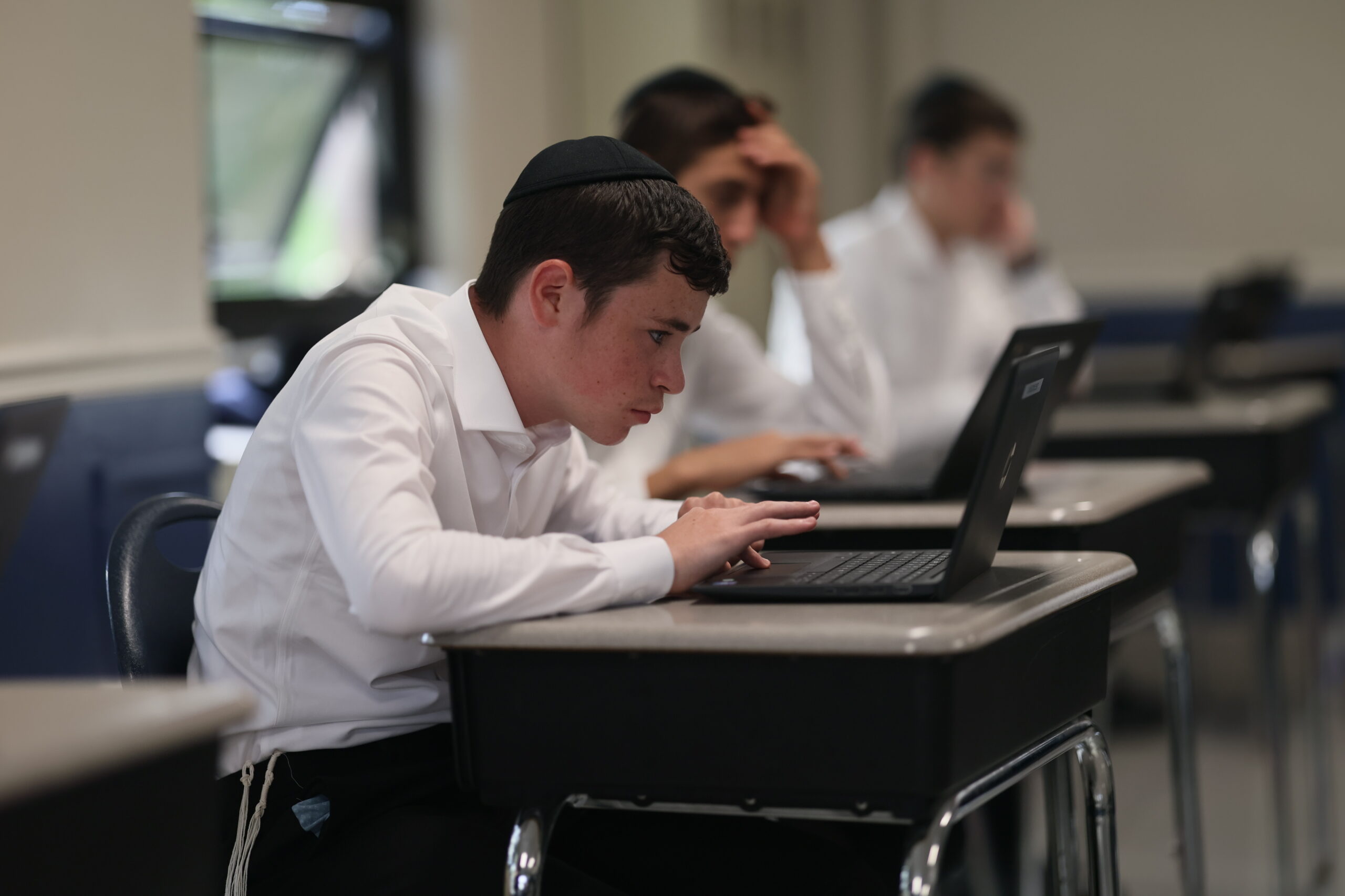 Students learning with laptops